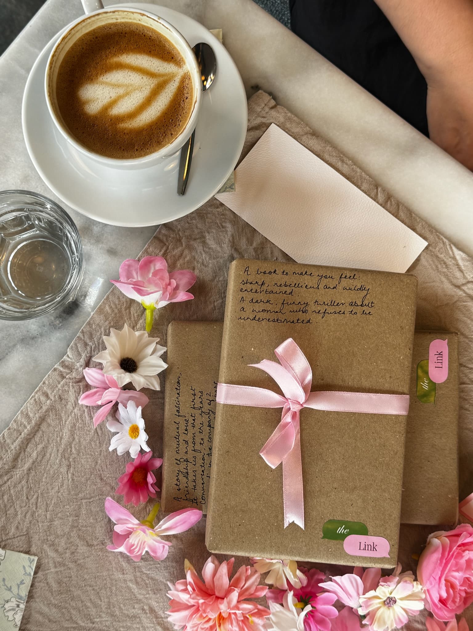 Coffee and a wrapped mystery book — The Link, Rotterdam