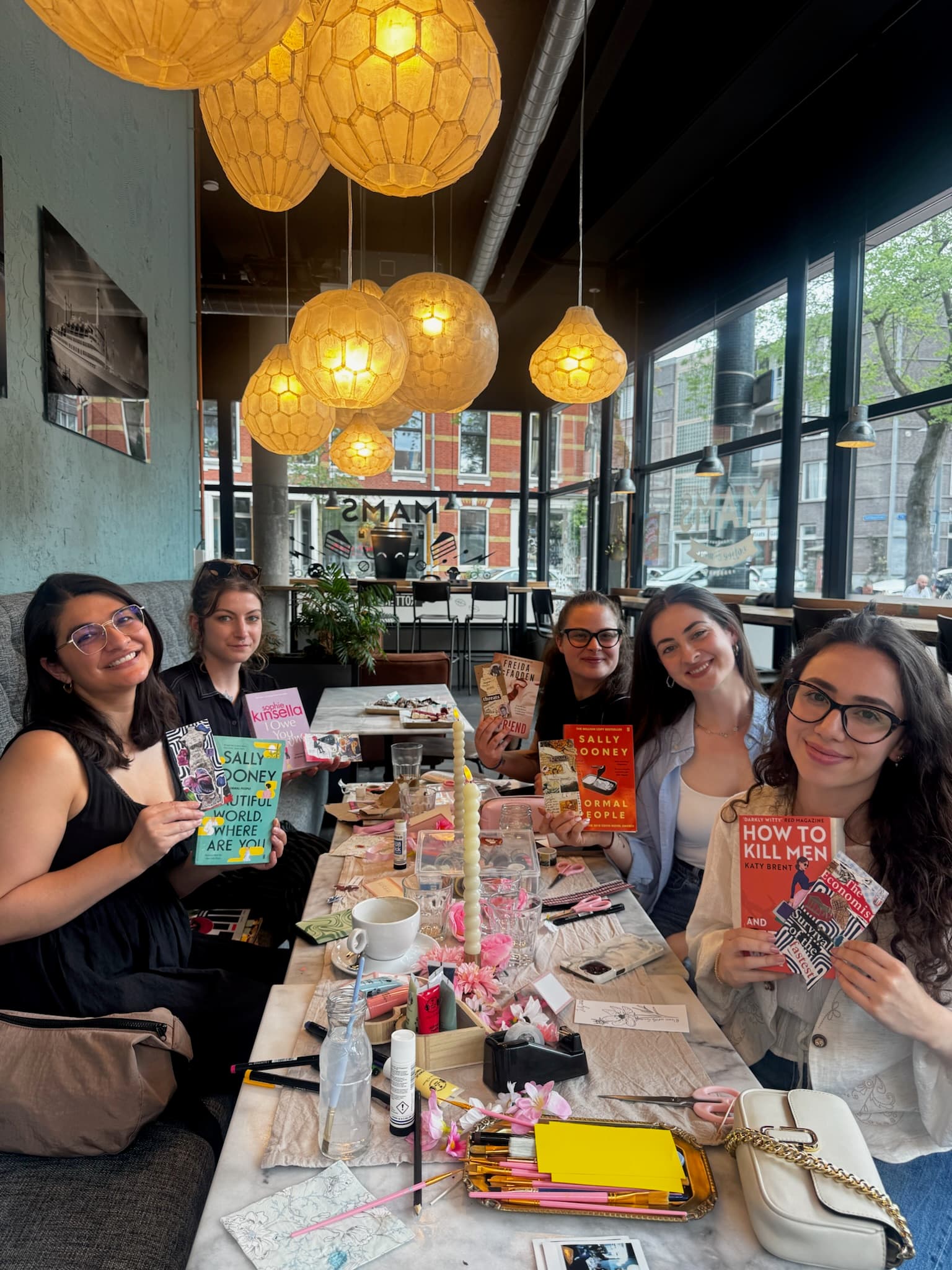 The whole table, books in hand — The Link, Rotterdam