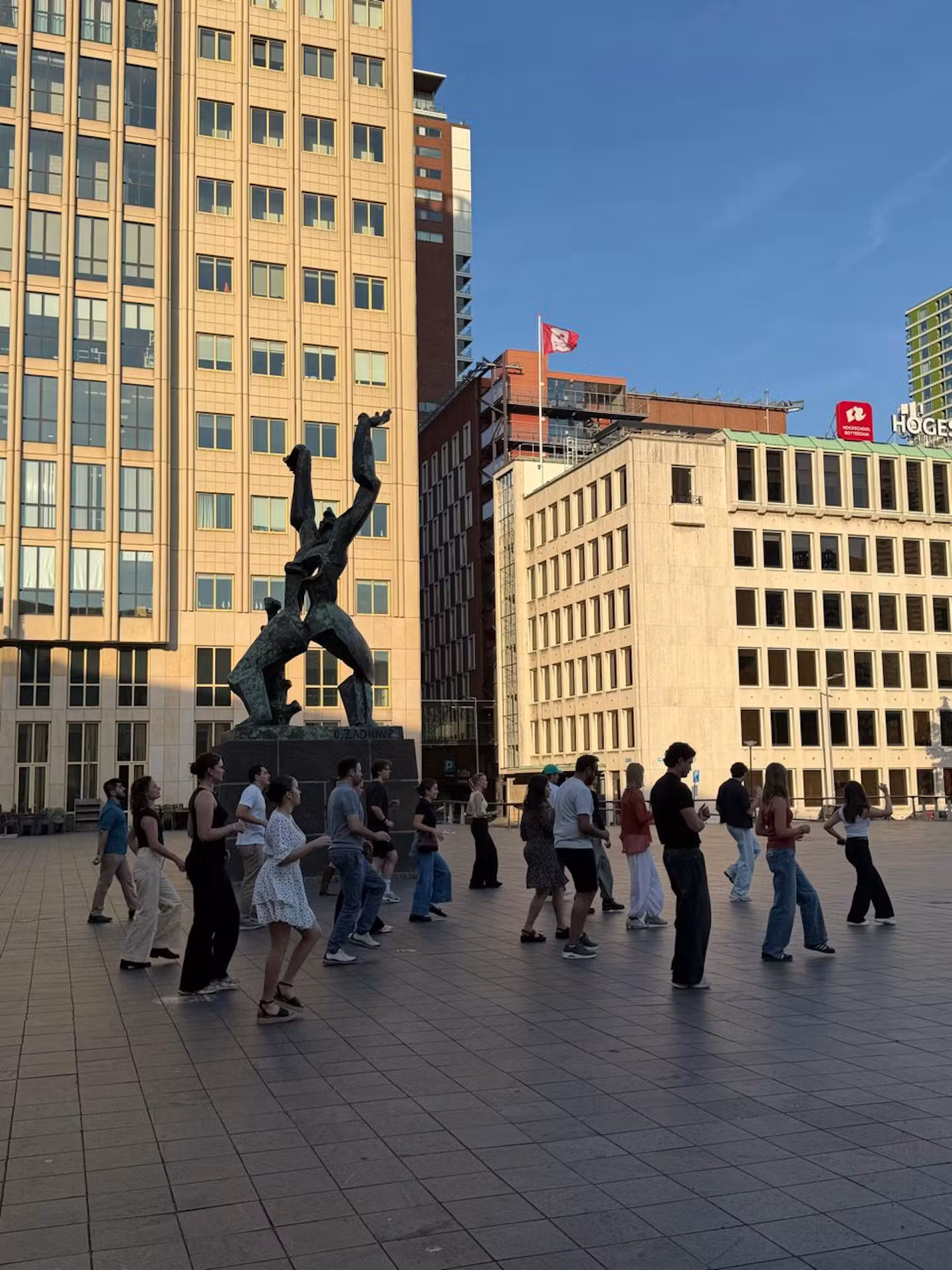Learning the basic step by the Zadkine statue — The Link, Rotterdam