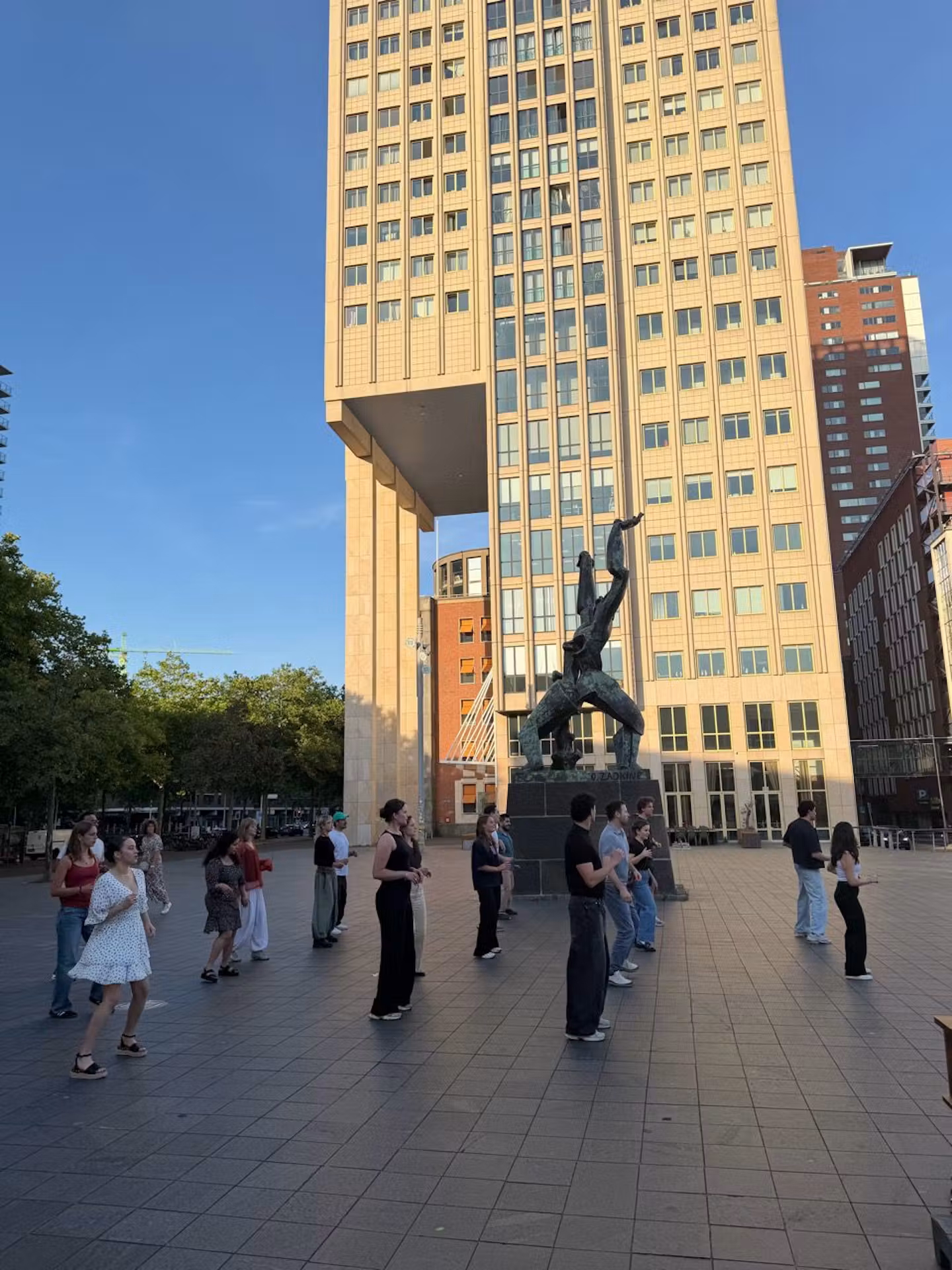 The whole group, mid-step at The Destroyed City — The Link, Rotterdam